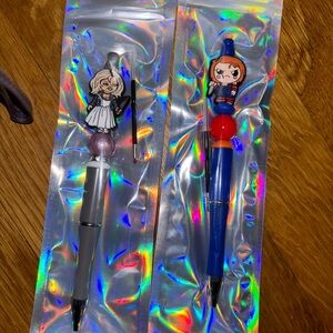 Hand made pens. Baby Chuckie and the bride of Chuckie. w/2 ink refills.